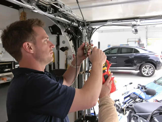 Windham Garage Door Repair safety certified technician performing cable replacement in Windham