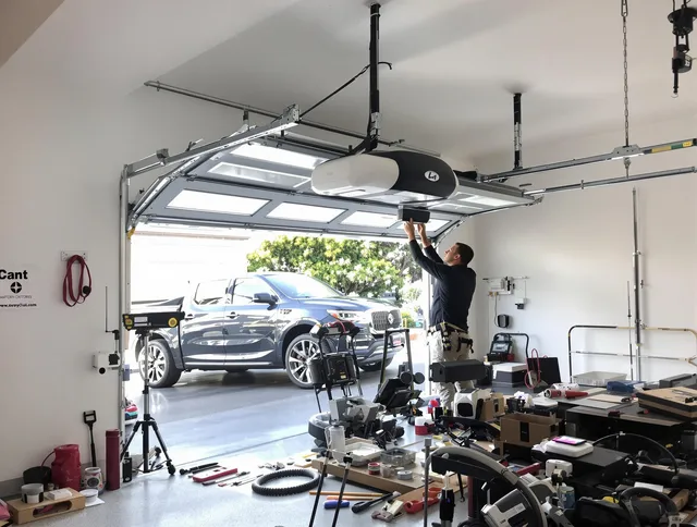 Windham Garage Door Repair specialist installing smart garage door opener system in Windham home