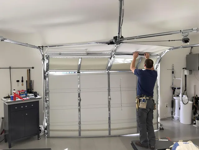 Windham Garage Door Repair specialist performing precise section replacement on Windham garage door