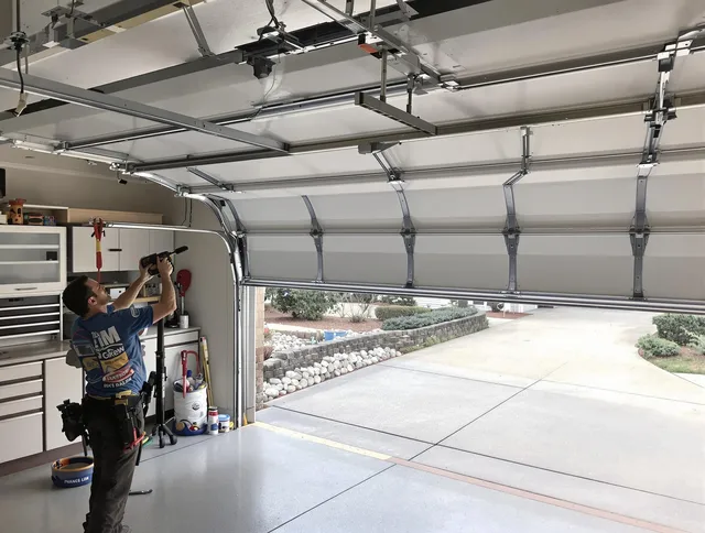 Garage door track repair service by Windham Garage Door Repair in Windham